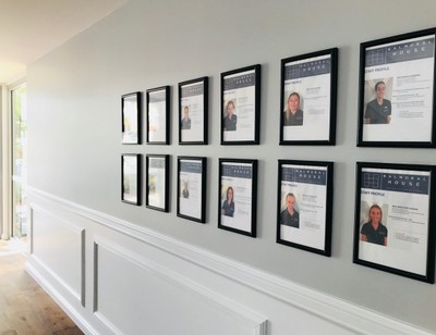 Framed photos of education team's profiles