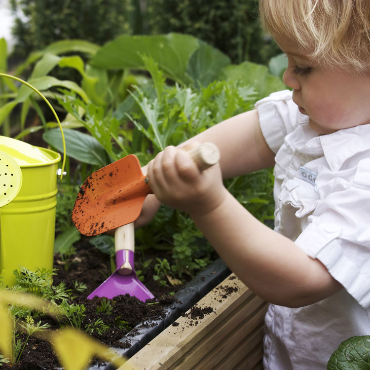 small boy gardening